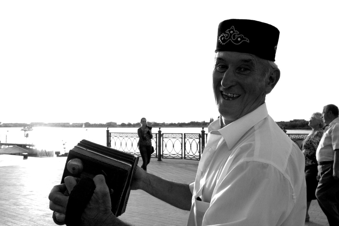 Tatar man playing harmonica