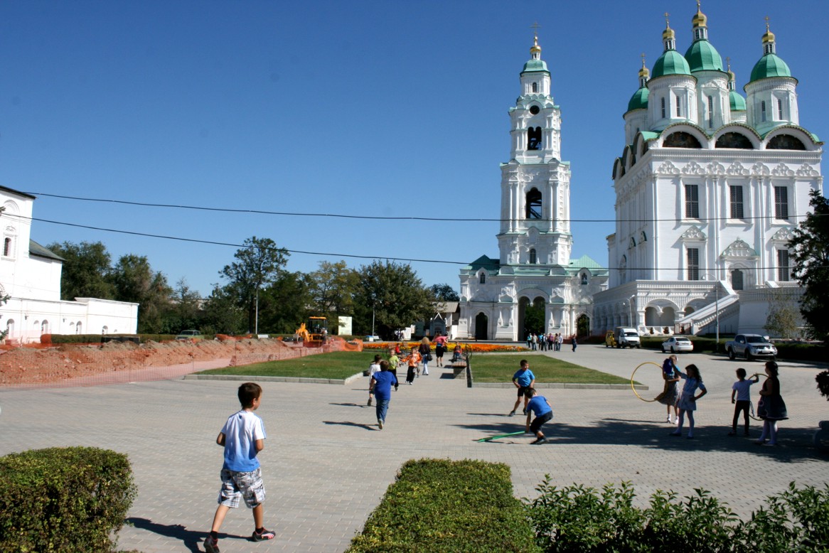 Children playing next to the Cathedral and the Bell Tower Children playing next to the Cathedral and the Bell Tower